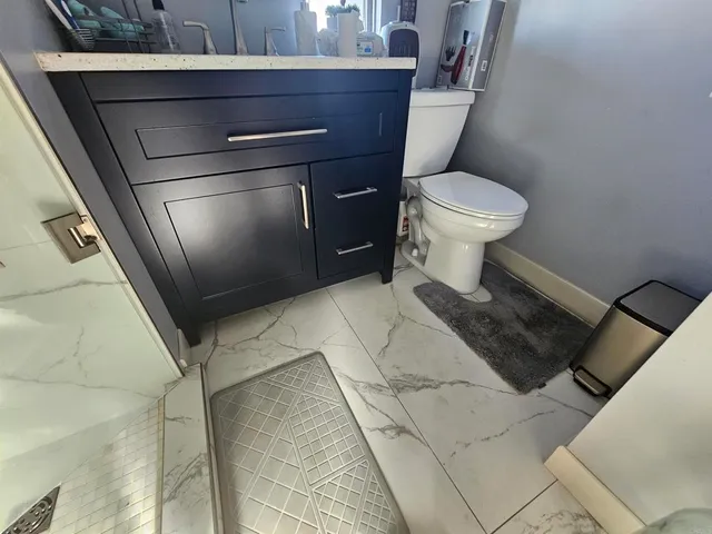 a bathroom with a toilet and a sink