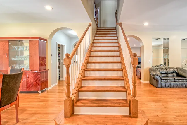 a view of an entryway with wooden floor and windows