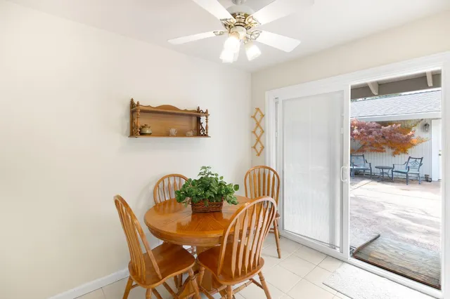a bedroom with two beds and a window