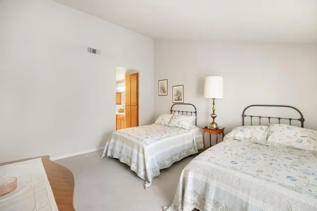 a bathroom with a shower and a glass door