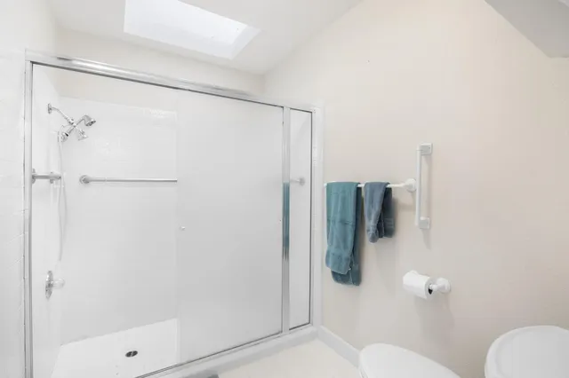 a bathroom with a sink double vanity and a mirror