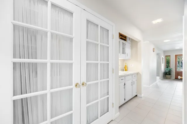 a living room with furniture white walls and a couch