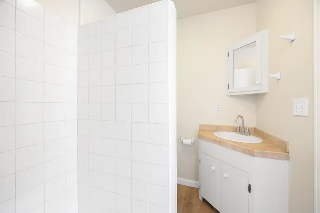 a kitchen with a stove a sink and a refrigerator