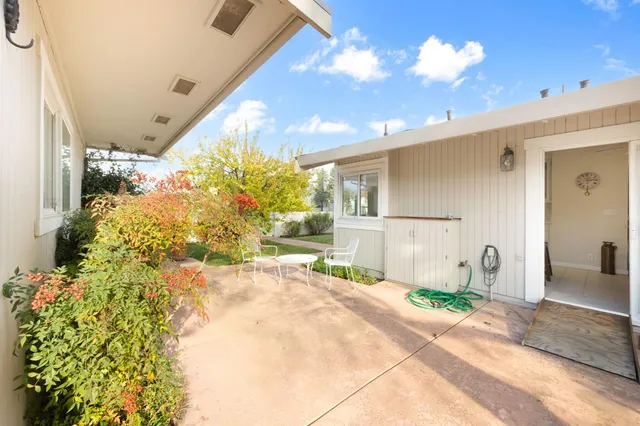 a view of a swimming pool with a yard