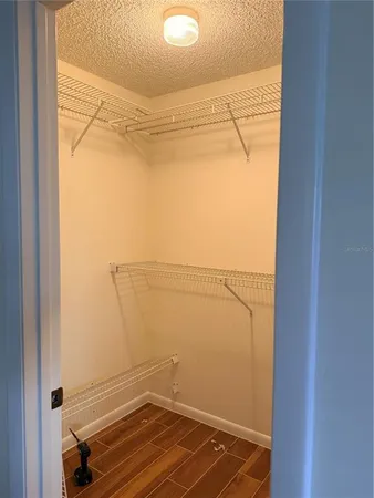 a view of a room with racks on the wall