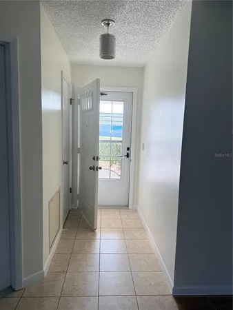 a bathroom with a granite countertop sink a mirror and a shower