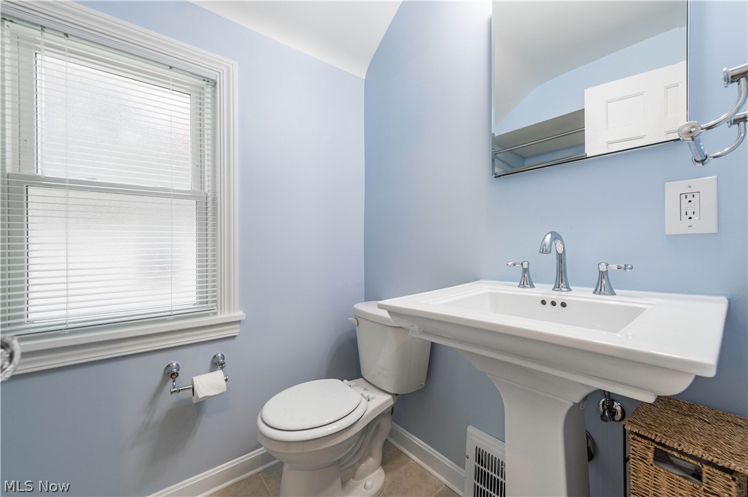 14414 Alger Road Cleveland, OH 44111 - Photo 13 of 33 Tastefully updated full bath combining modern convenience with classic charm.