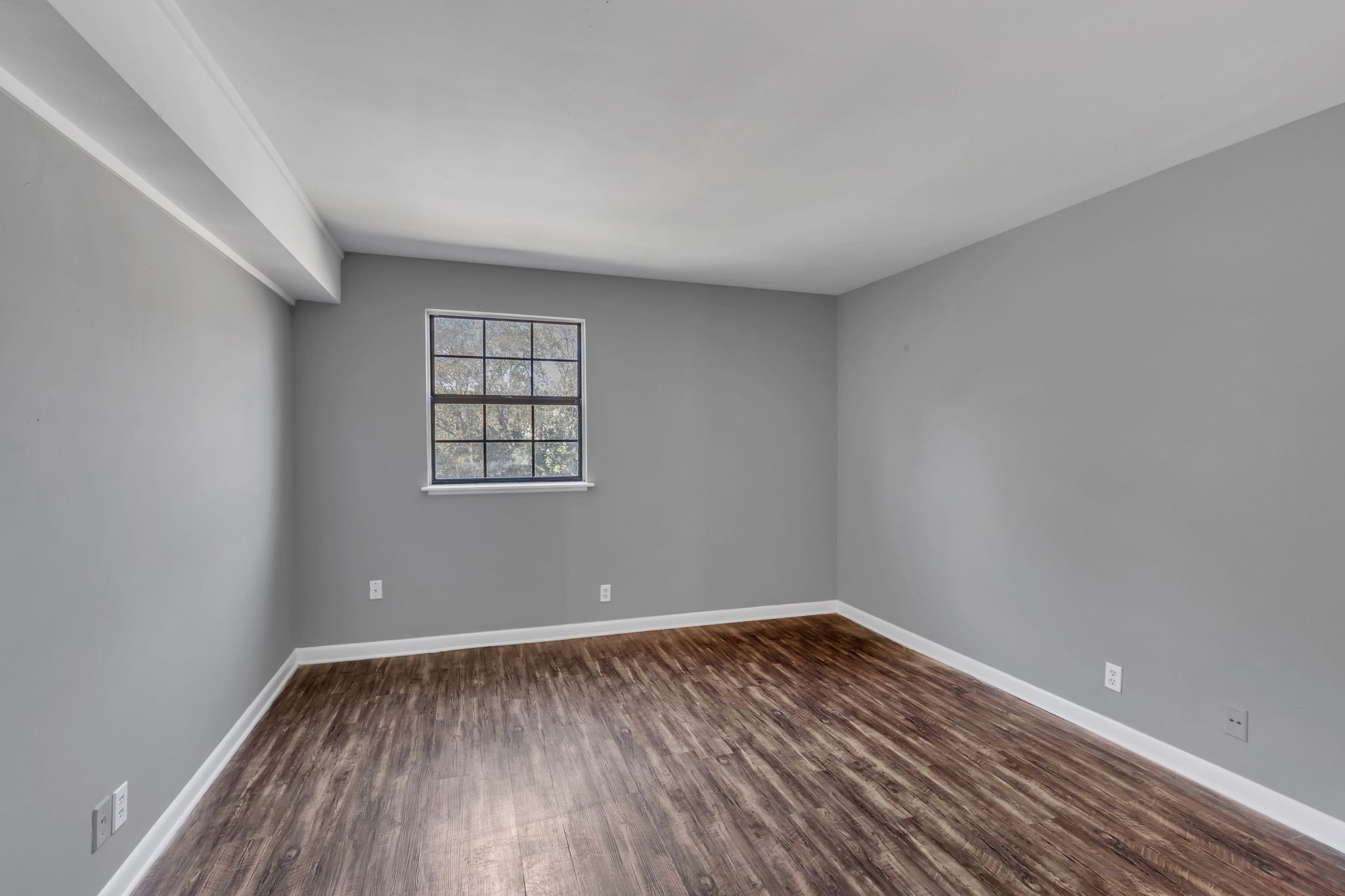 420 Walton Lane, Unit I41 Madison, TN 37115 - Photo 13 of 20 wooden floor in an empty room with a window