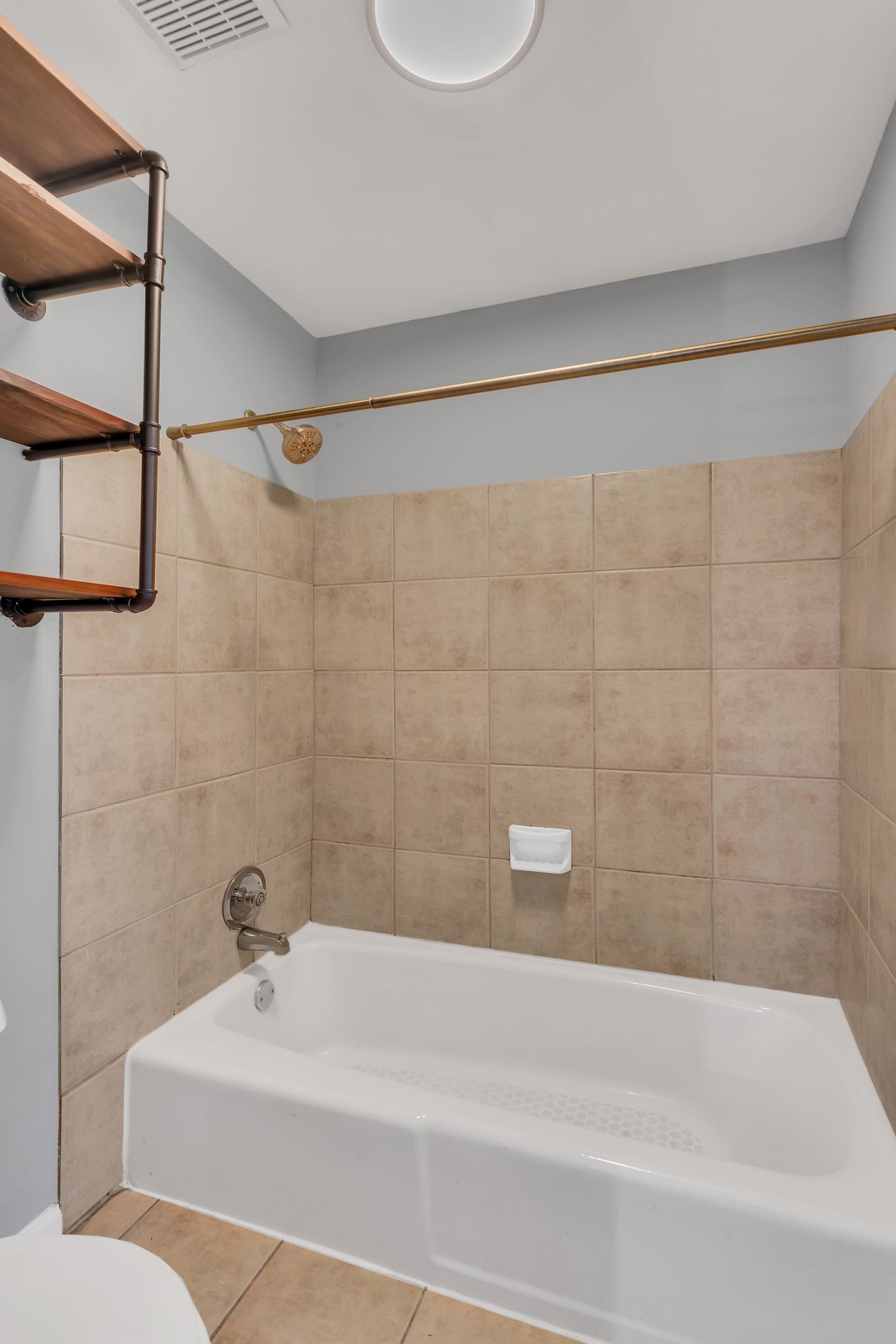 420 Walton Lane, Unit I41 Madison, TN 37115 - Photo 15 of 20 a bathroom with a bathtub a sink and a shower
