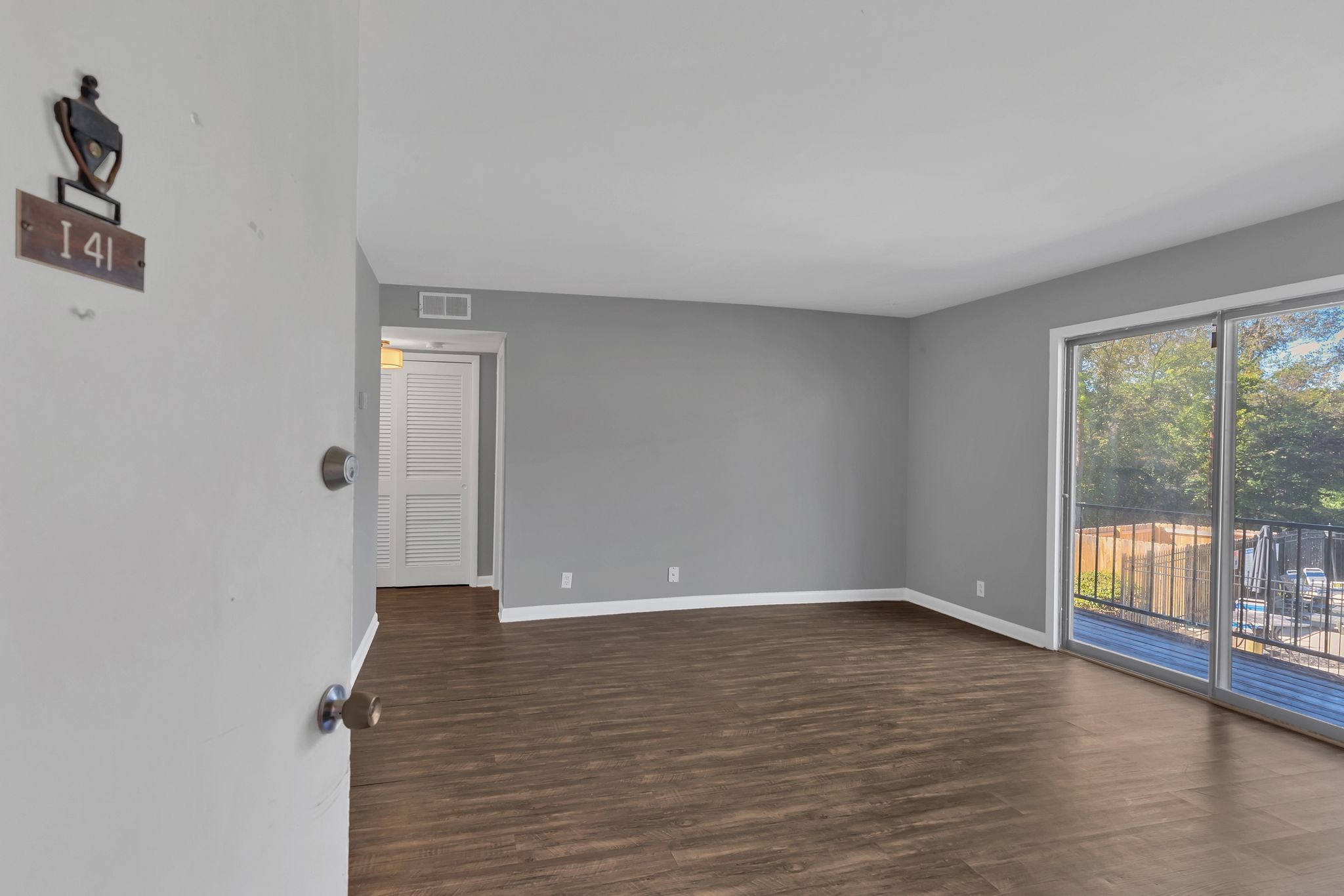 420 Walton Lane, Unit I41 Madison, TN 37115 - Photo 2 of 20 wooden floor in an empty room with a window