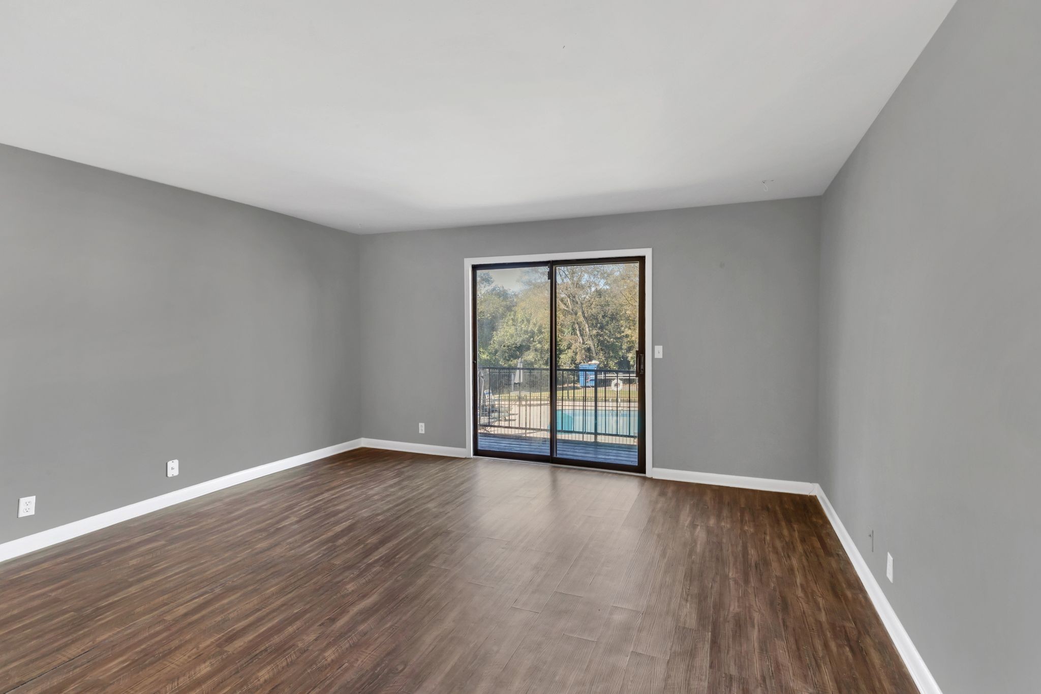 420 Walton Lane, Unit I41 Madison, TN 37115 - Photo 4 of 20 a view of an empty room with wooden floor and a window