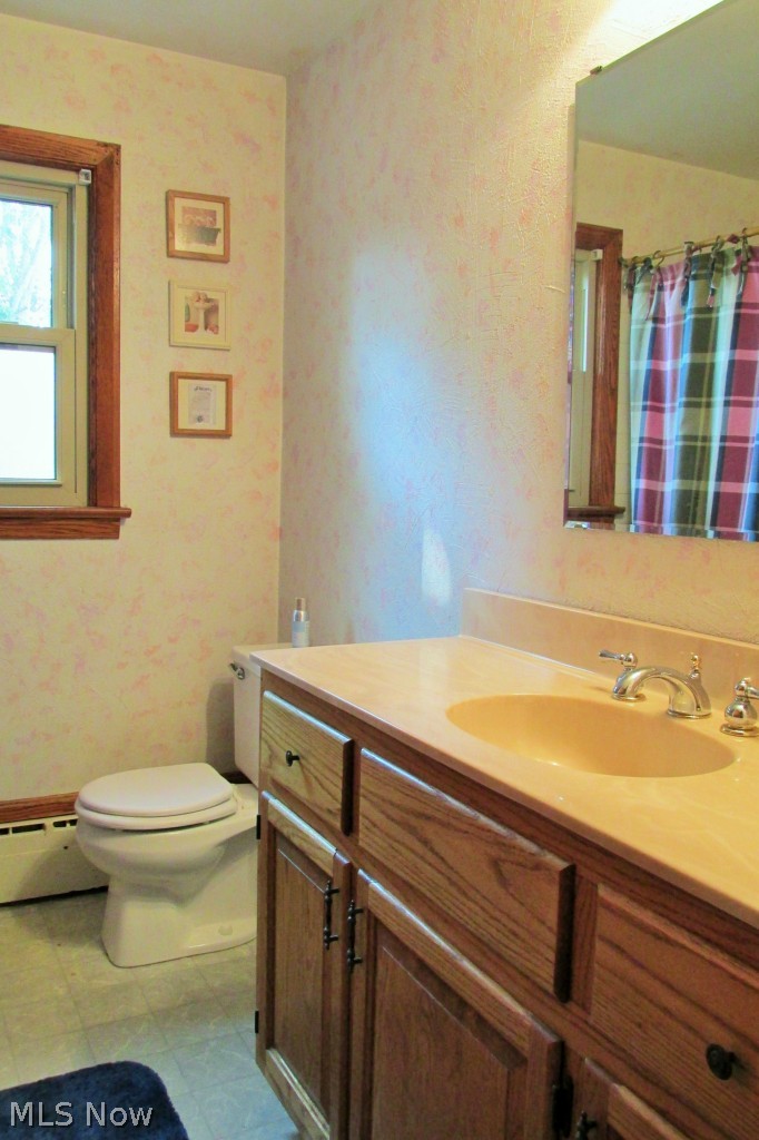 9801 Yoder Road Sterling, OH 44276 - Photo 16 of 25 Main floor full bath with tub/shower and behind the door linen/supply storage