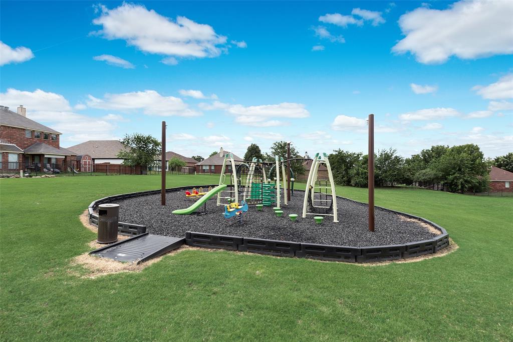 149 Cattlemans Creek Road Newark, TX 76071 - Photo 34 of 39 Community playground at 149 Cattlemans Creek Rd in the Chisholm Springs neighborhood in Newark, TX 76071