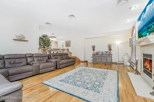 a kitchen with stainless steel appliances kitchen island granite countertop a refrigerator and cabinets