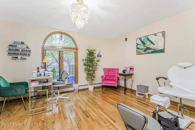 a view of entryway with wooden floor and windows
