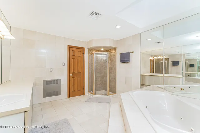 a bedroom with bed and wooden floor