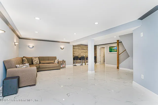a view of a chairs and table in the back yard of the house