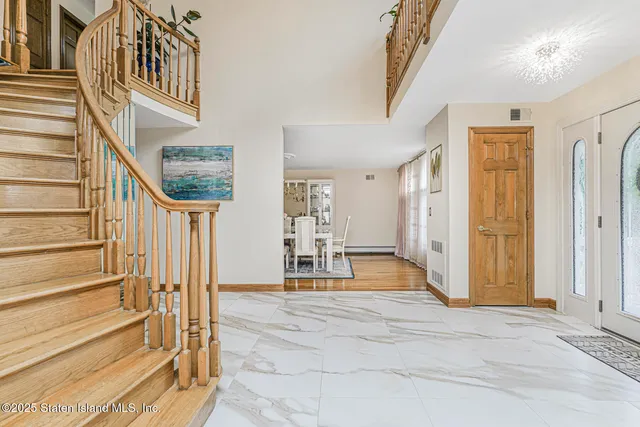 a view of front door with staircase