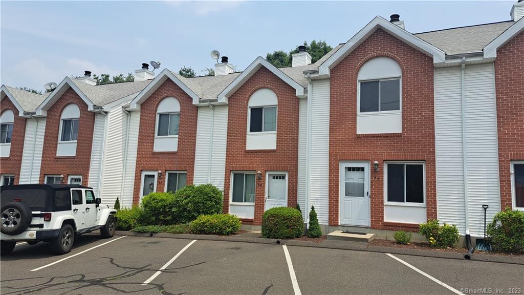 a front view of a house with yard