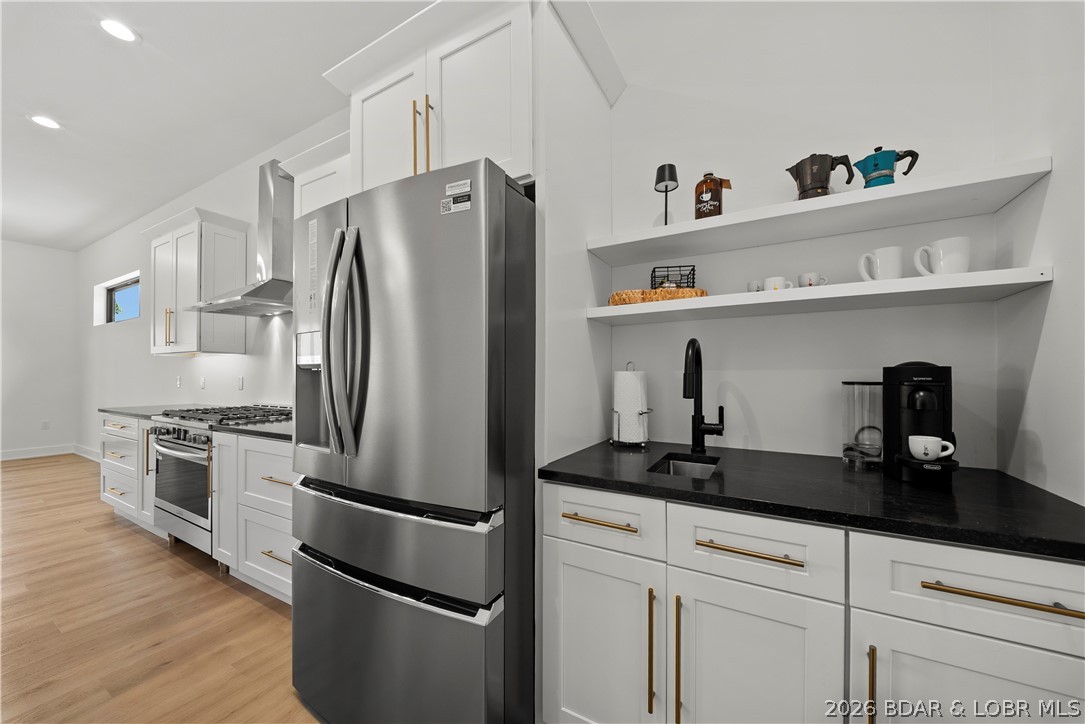 222 Red Bud Road Lake Ozark, MO 65049 - Photo 13 of 64 High-end appliances and custom cabinetry elevate t