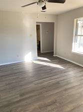 300 Pr 4382 Decatur, TX 76234 - Photo 2 of 6 an empty room with wooden floor and windows