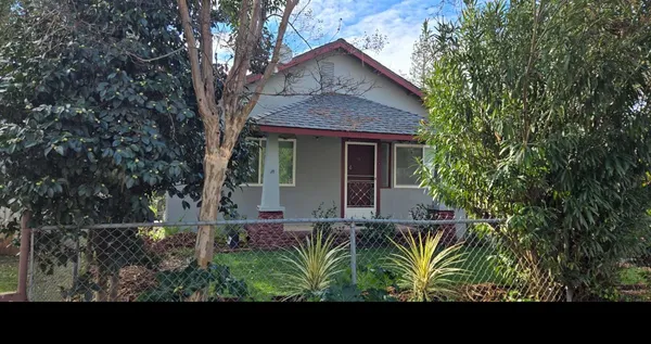 a view of front of house with a yard