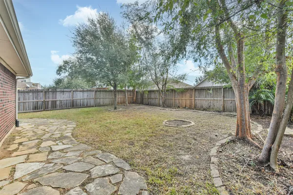 a backyard of a house with lots of green space