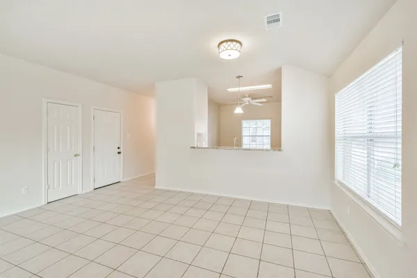 a view of an empty room and window