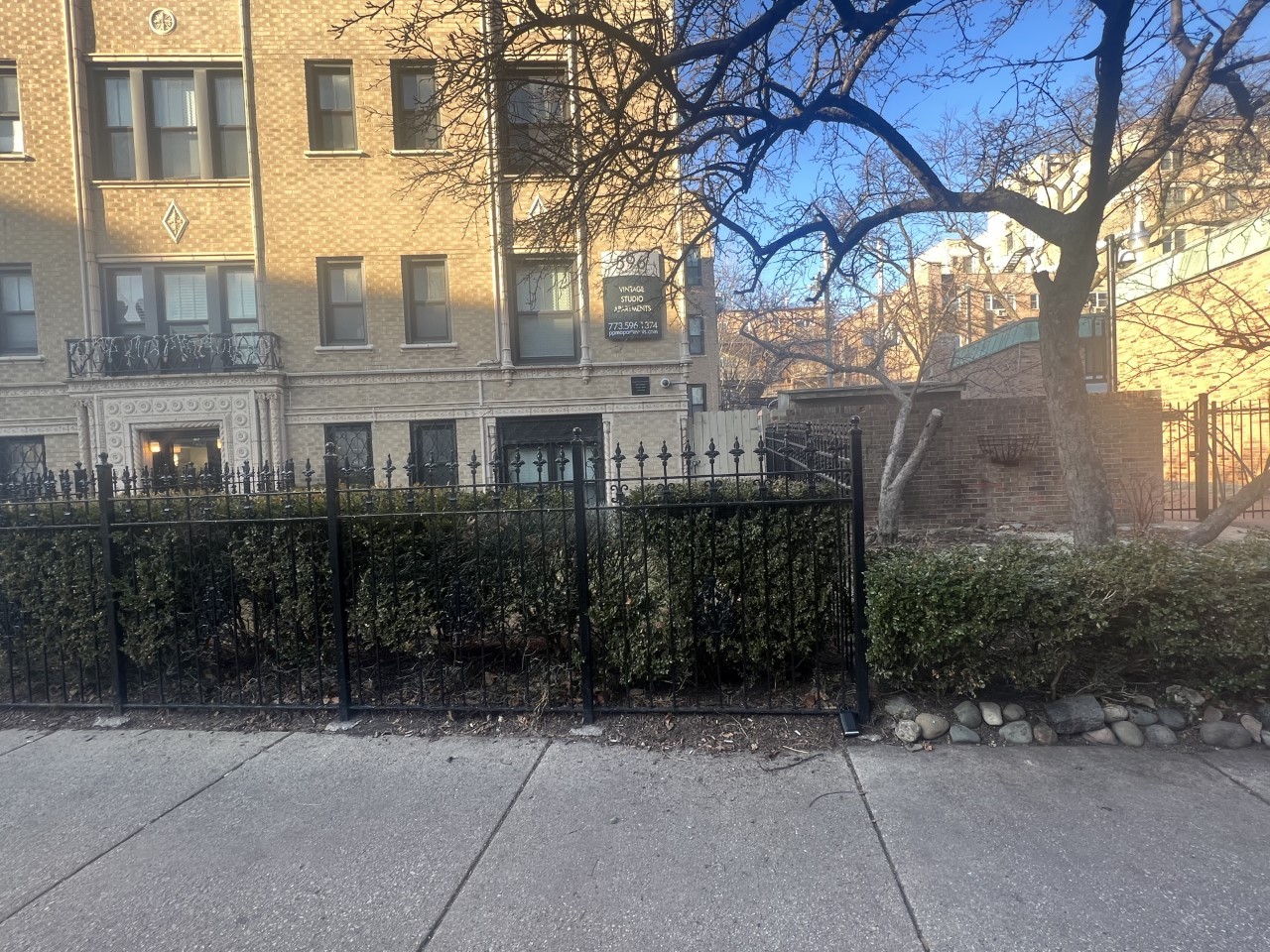 596 West Hawthorne Place, Unit 208 Chicago, IL 60657 - Photo 1 of 8 a view of a building with a yard