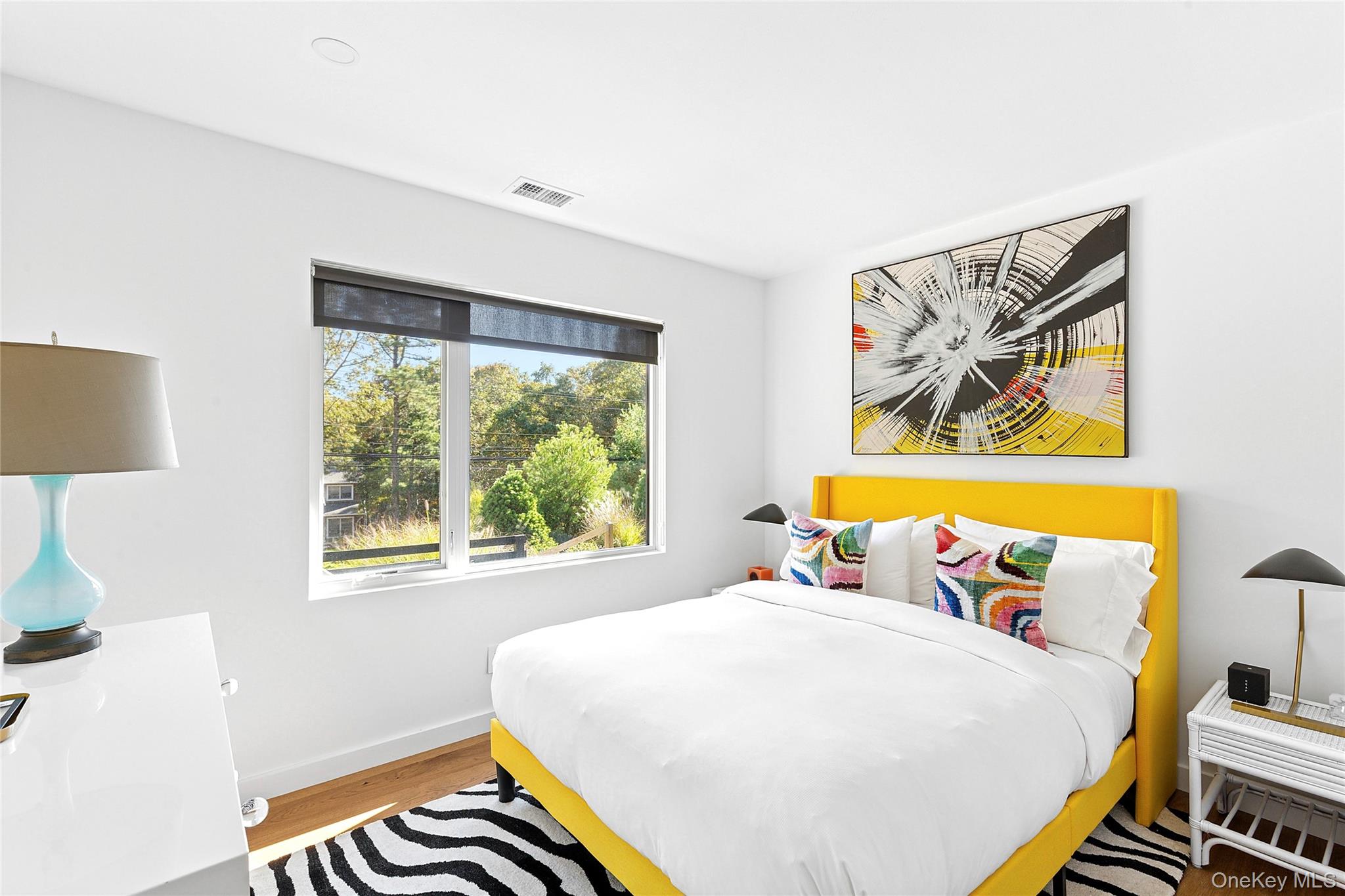 70 Whooping Hollow Road East Hampton, NY 11937 - Photo 13 of 15 a bedroom with a bed and a window