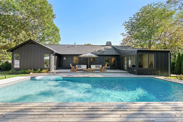 a front view of a house with garden and porch