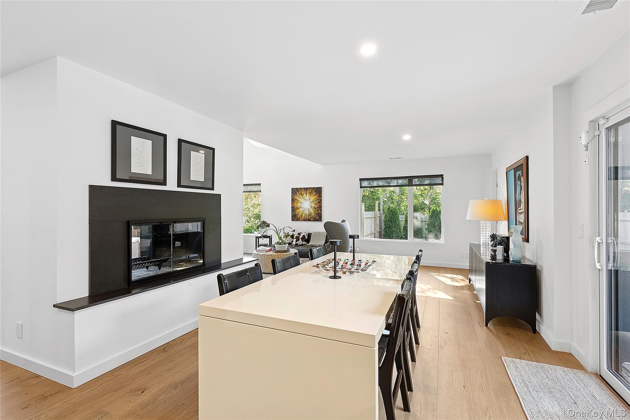 70 Whooping Hollow Road East Hampton, NY 11937 - Photo 8 of 15 a view of a livingroom with furniture window and a fireplace