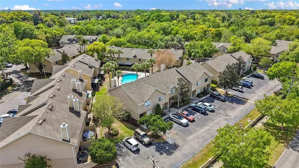 an aerial view of a house with a yard
