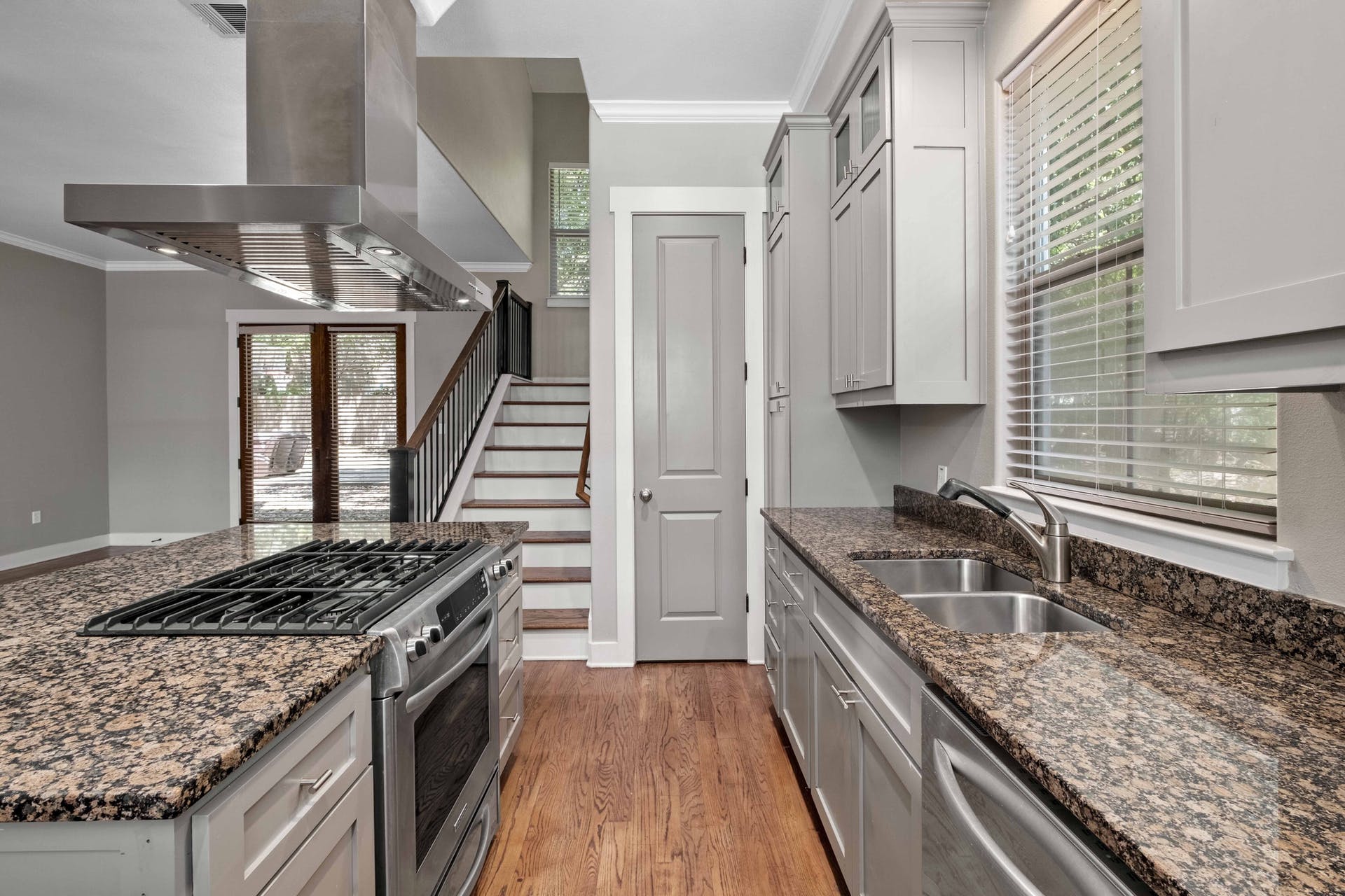 2309 A Longview Street, Unit A Austin, TX 78705 - Photo 3 of 13 a kitchen with stainless steel appliances granite countertop a stove and a sink