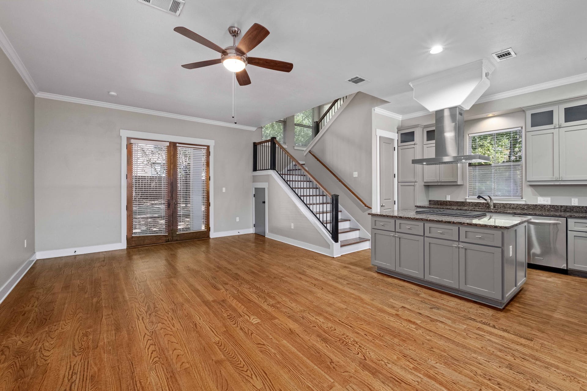 2309 A Longview Street, Unit A Austin, TX 78705 - Photo 4 of 13 a view of an empty room with wooden floor and a ceiling fan