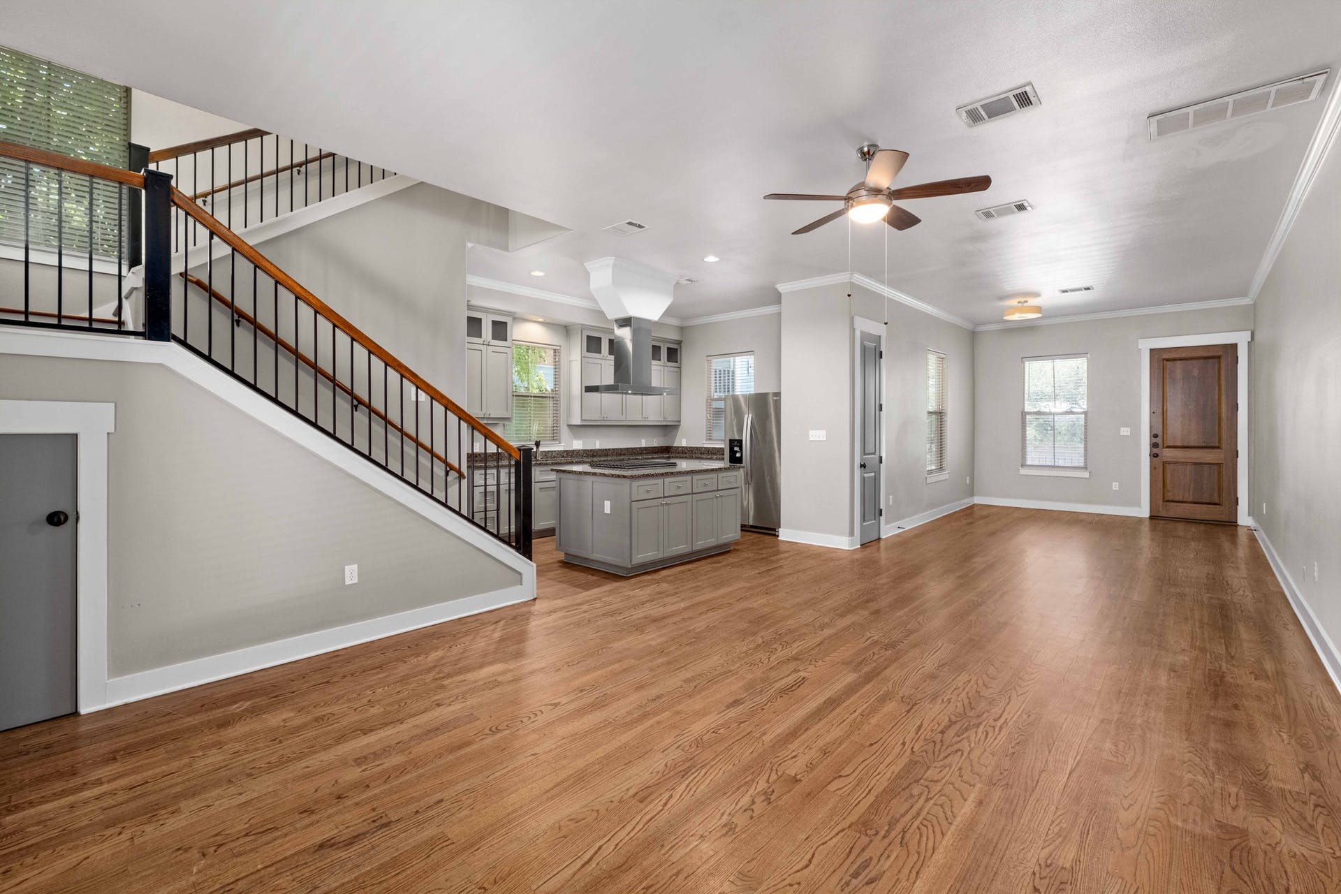 2309 A Longview Street, Unit A Austin, TX 78705 - Photo 6 of 13 a view of a room with wooden floor and staircase