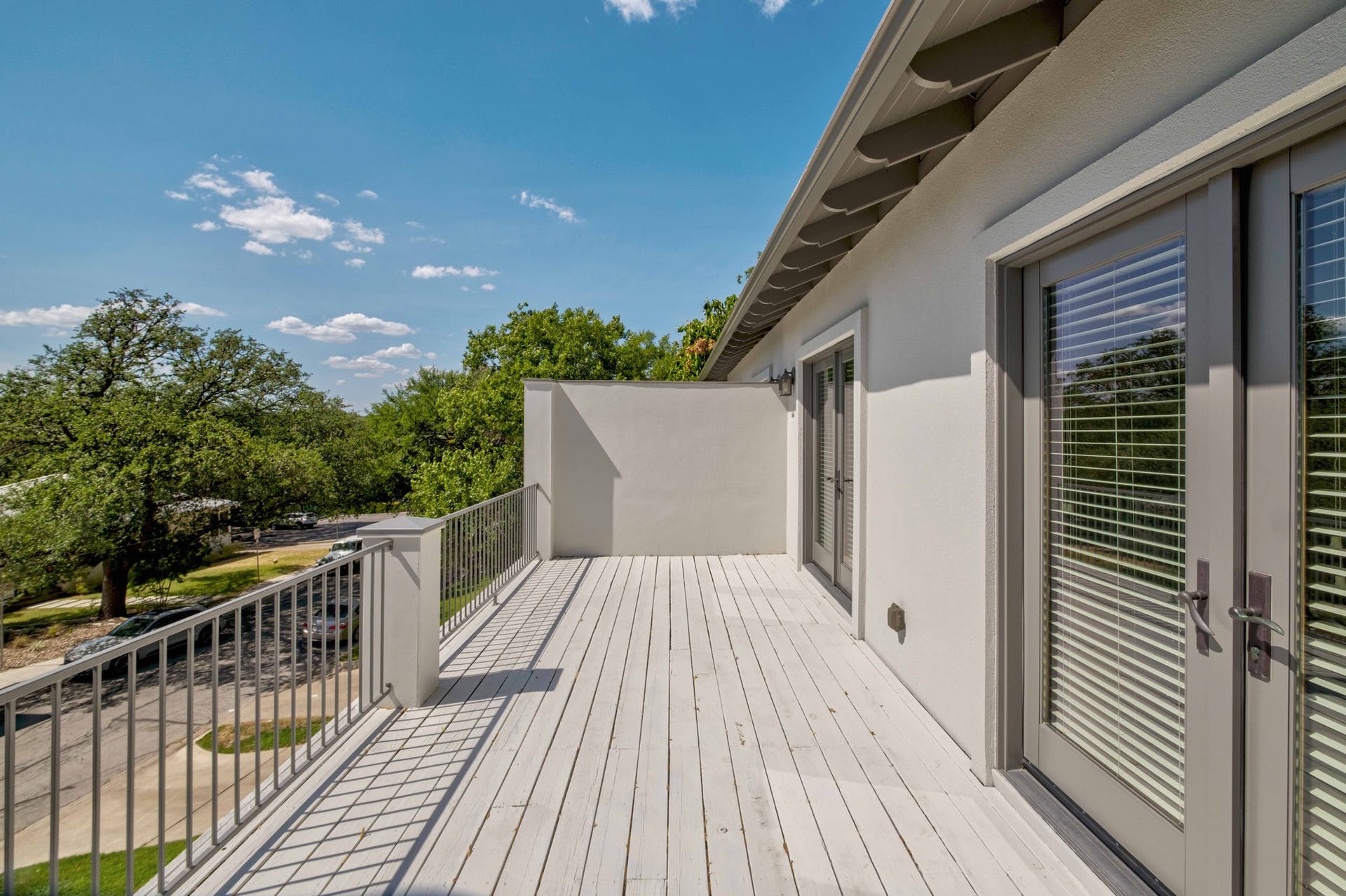 2309 A Longview Street, Unit A Austin, TX 78705 - Photo 7 of 13 a view of balcony with wooden floor and fence