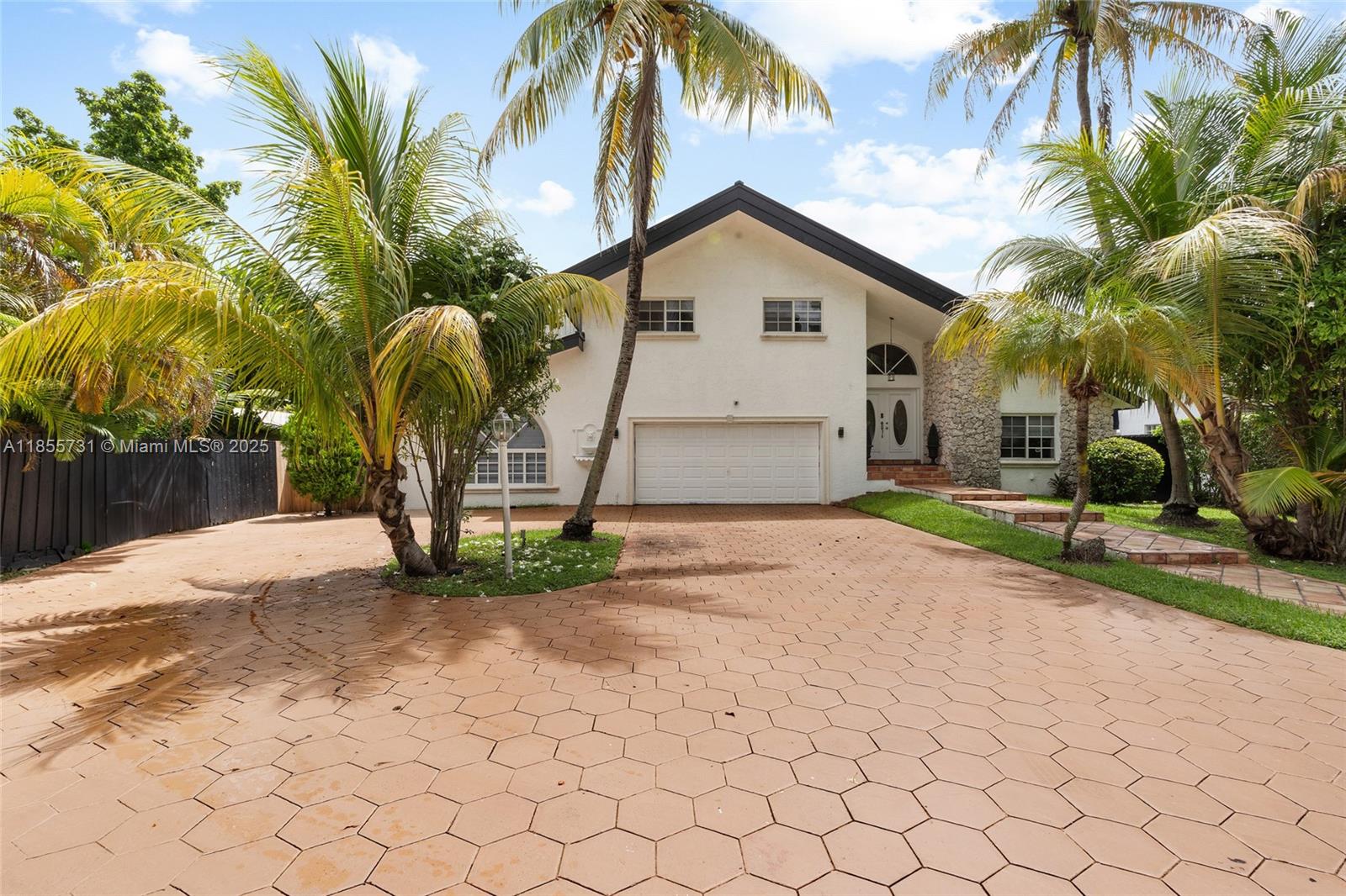 10723 Southwest 142nd Court Miami, FL 33186 - Photo 1 of 54 a view of a house with a yard and coconut trees