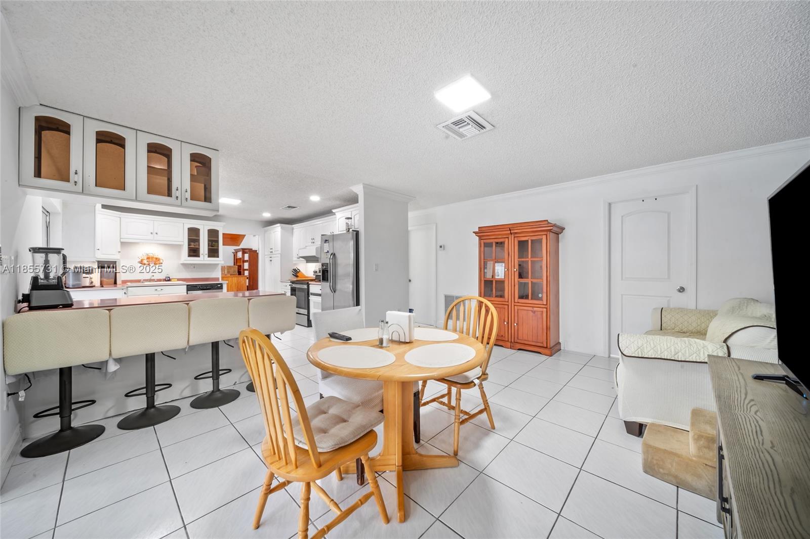10723 Southwest 142nd Court Miami, FL 33186 - Photo 29 of 54 a dining room with furniture and wooden floor