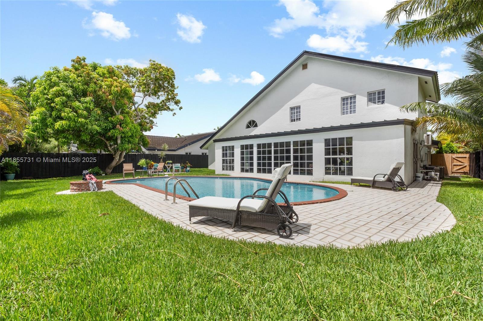 10723 Southwest 142nd Court Miami, FL 33186 - Photo 32 of 54 a view of a house with a yard patio and slide