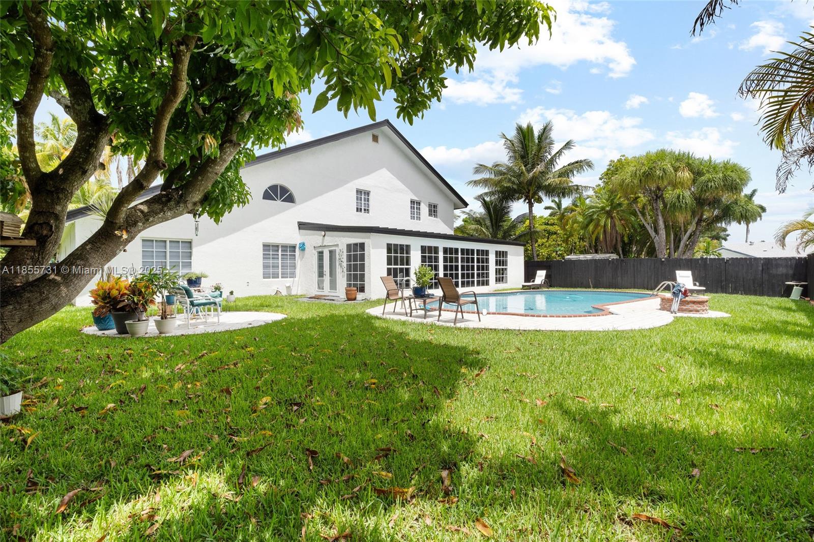 10723 Southwest 142nd Court Miami, FL 33186 - Photo 35 of 54 a front view of a house with garden