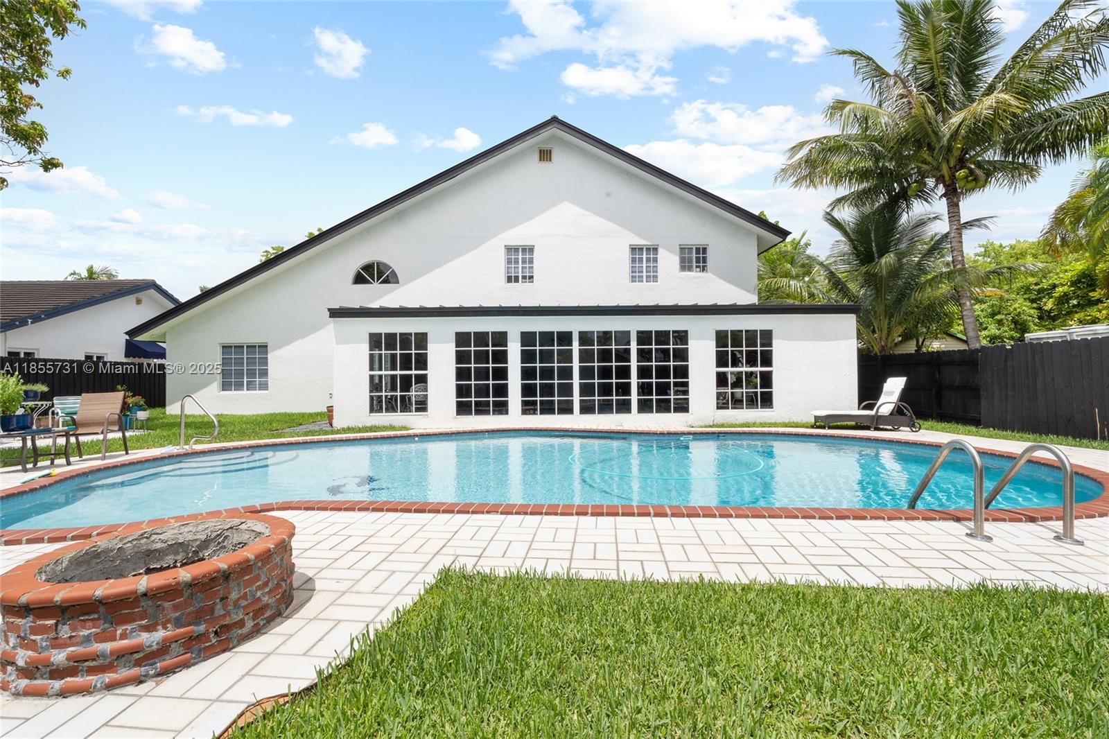 10723 Southwest 142nd Court Miami, FL 33186 - Photo 36 of 54 a front view of a house with a yard