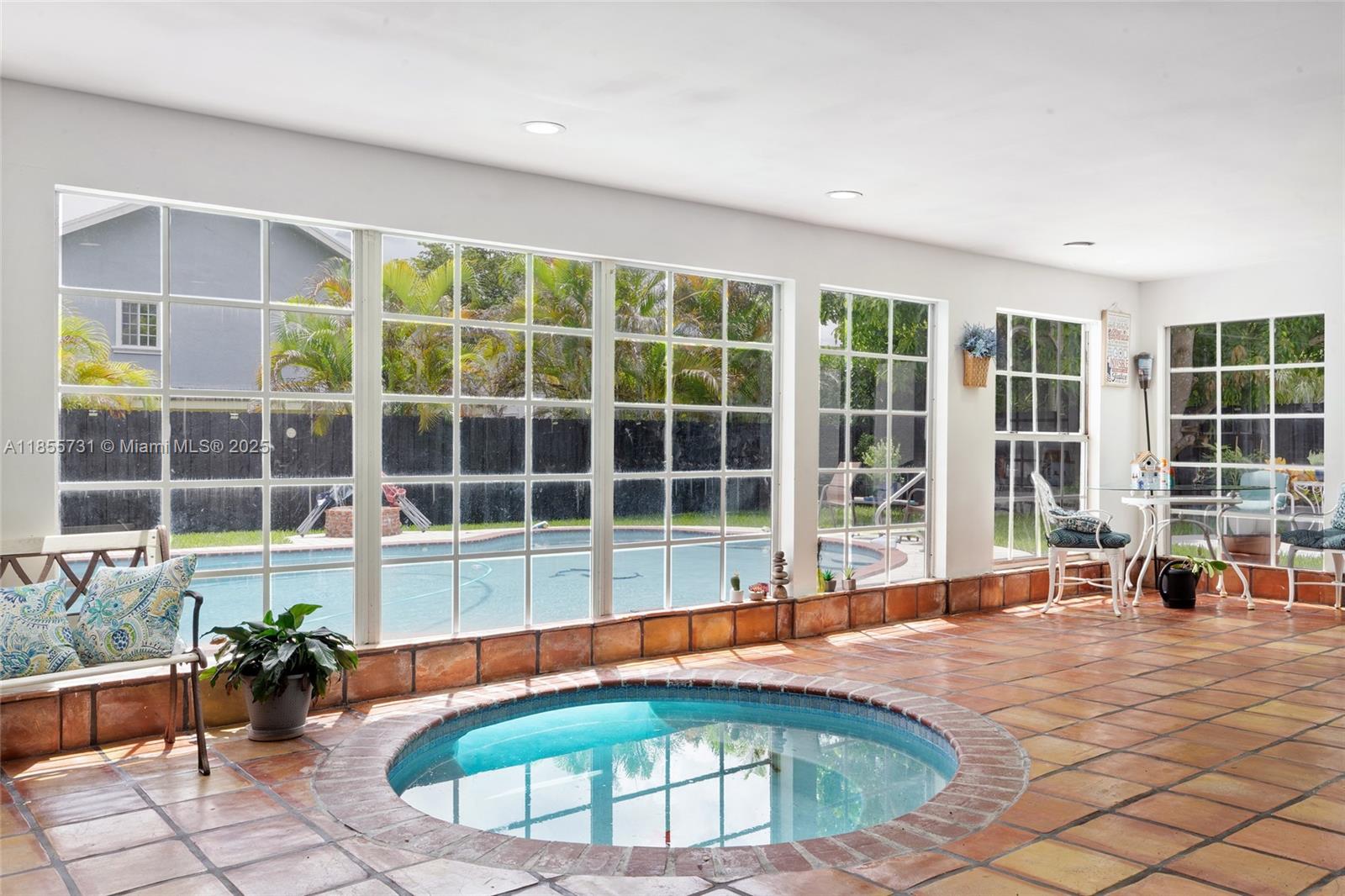 10723 Southwest 142nd Court Miami, FL 33186 - Photo 42 of 54 a view of a swimming pool with a lounge chair
