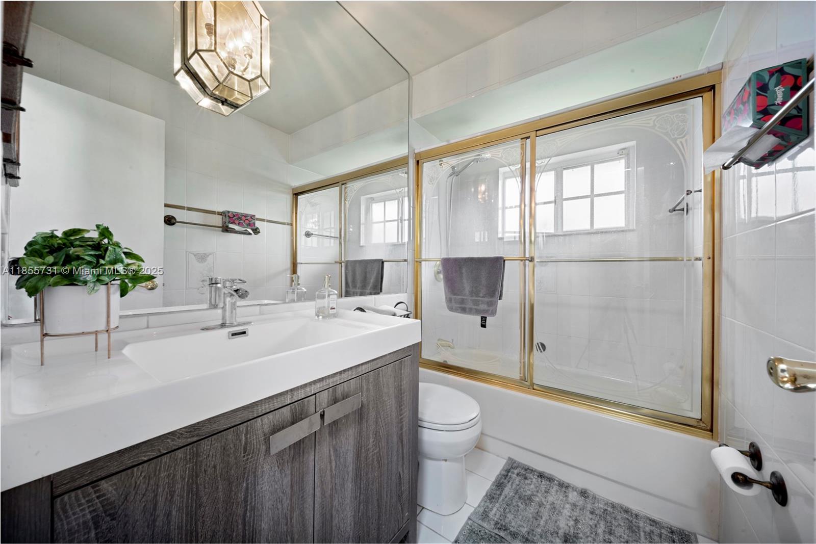 10723 Southwest 142nd Court Miami, FL 33186 - Photo 49 of 54 a spacious bathroom with a sink a toilet and shower