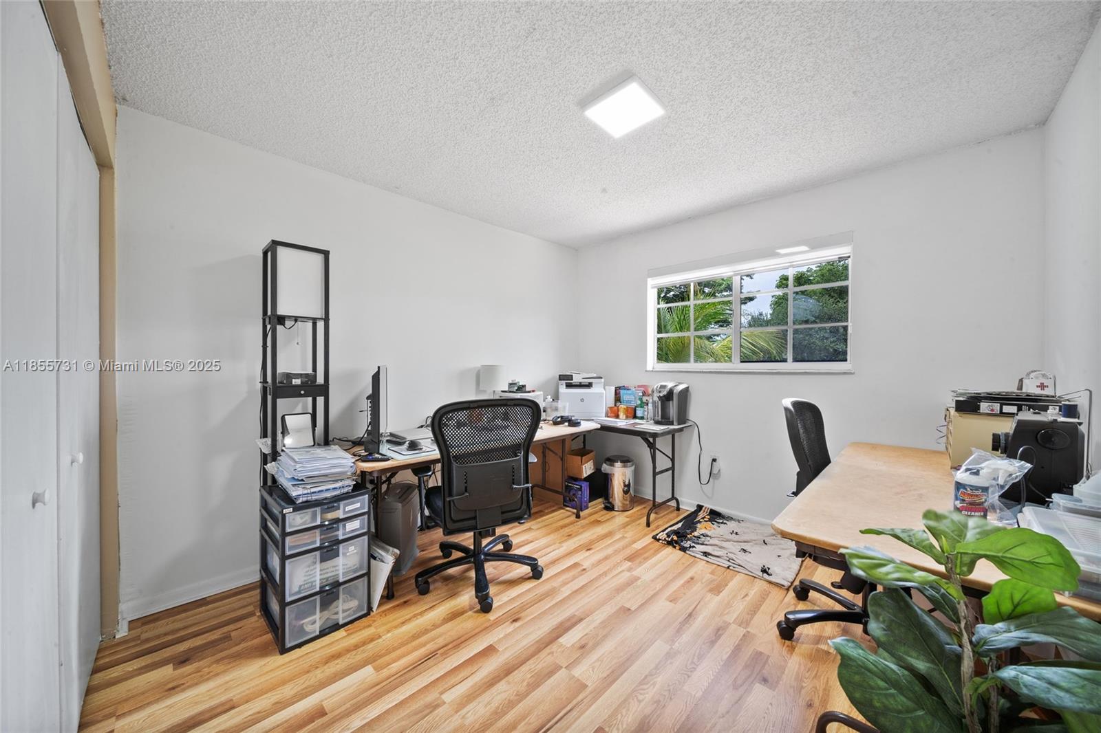 10723 Southwest 142nd Court Miami, FL 33186 - Photo 50 of 54 a view of a workspace with furniture and lounge chair