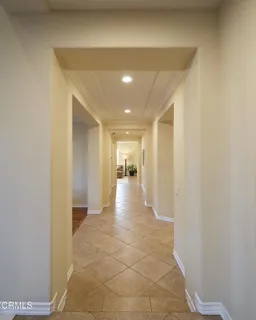 a kitchen with granite countertop a sink stove and cabinets