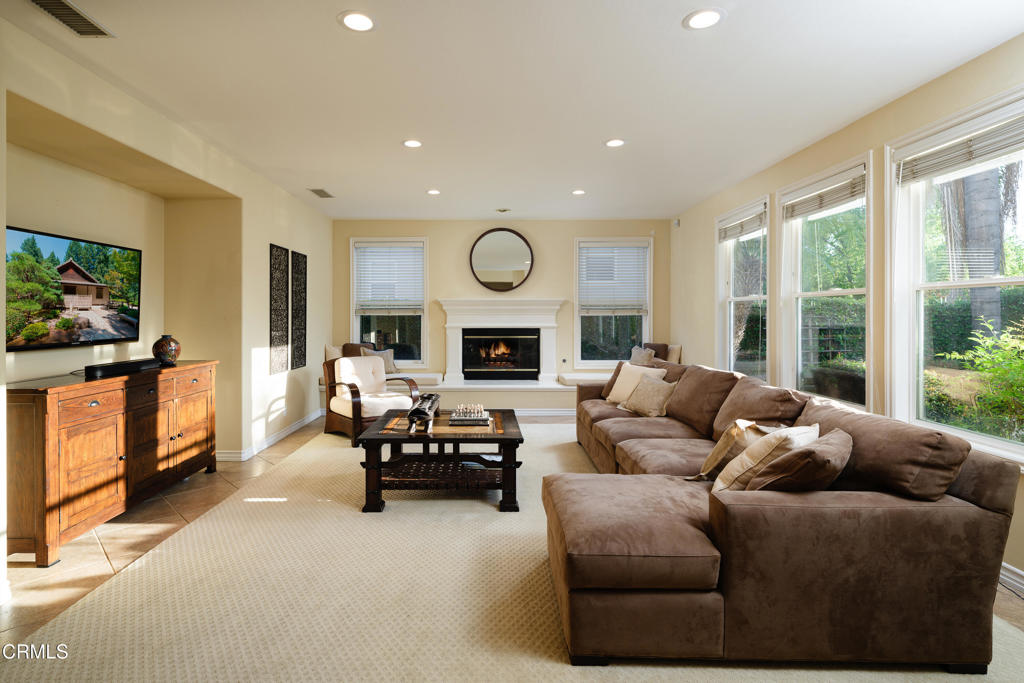 3921 Chapman Court Altadena, CA 91001 - Photo 16 of 64 a living room with furniture fireplace and a large window