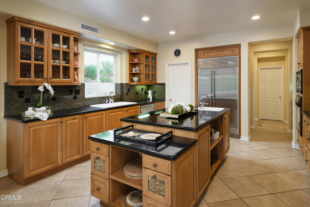 3921 Chapman Court Altadena, CA 91001 - Photo 20 of 64 a kitchen with granite countertop a sink stove and cabinets