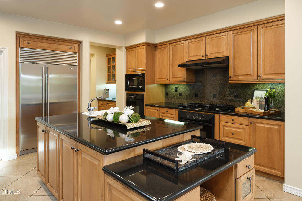3921 Chapman Court Altadena, CA 91001 - Photo 22 of 64 a kitchen with stainless steel appliances granite countertop a stove and a sink