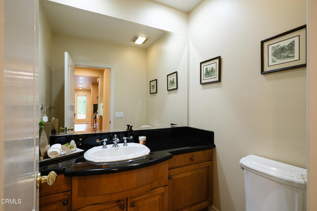 3921 Chapman Court Altadena, CA 91001 - Photo 23 of 64 a bathroom with a sink and a mirror with toilet